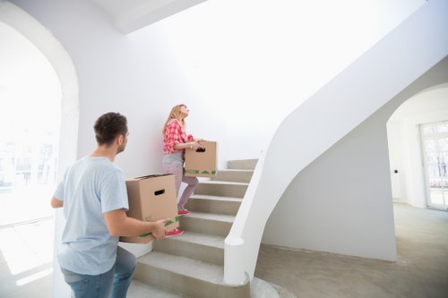 Carefully boxed household items prepared by packing services in Rushgreen